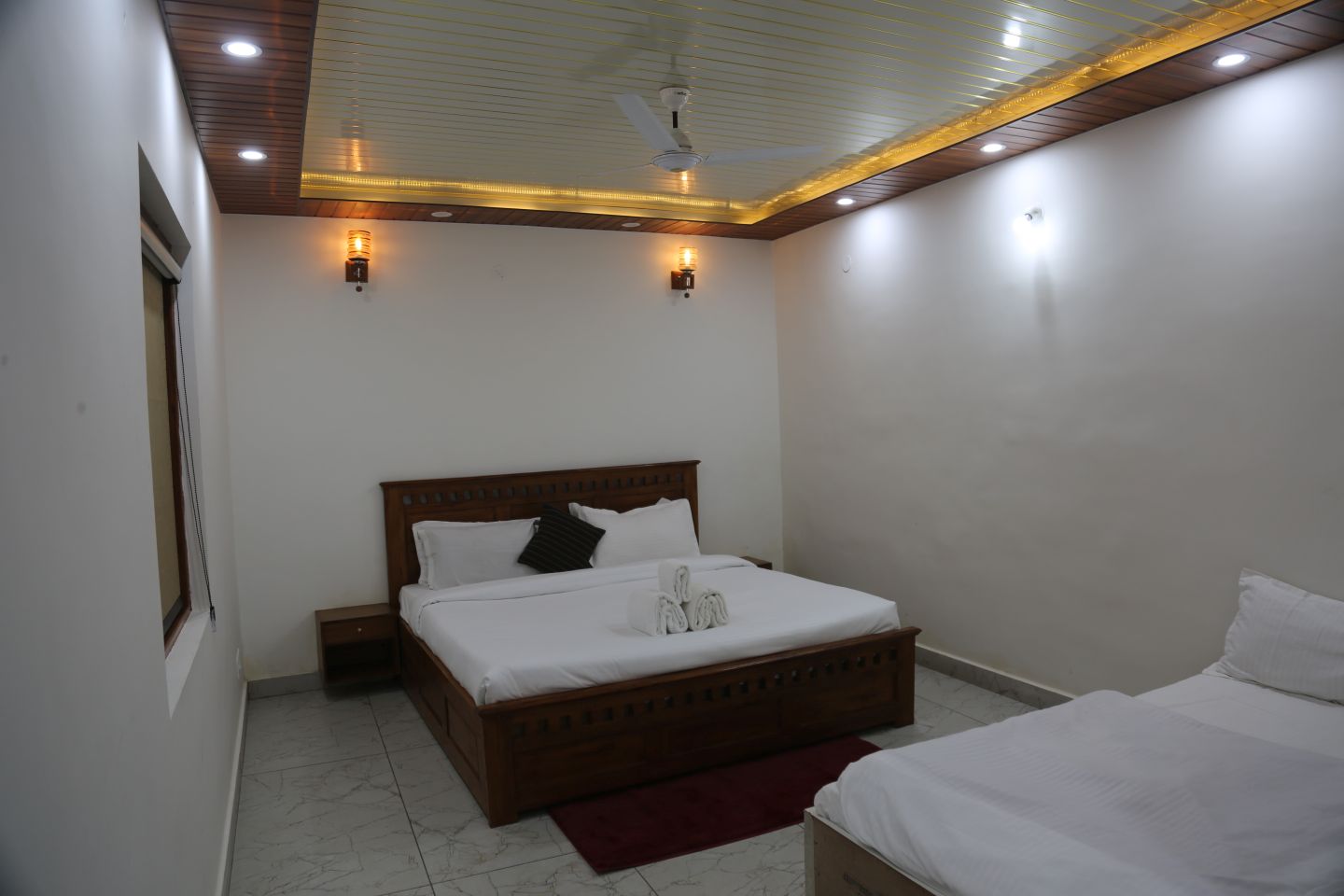 Executive Suite bedroom with full size bed and side sofa