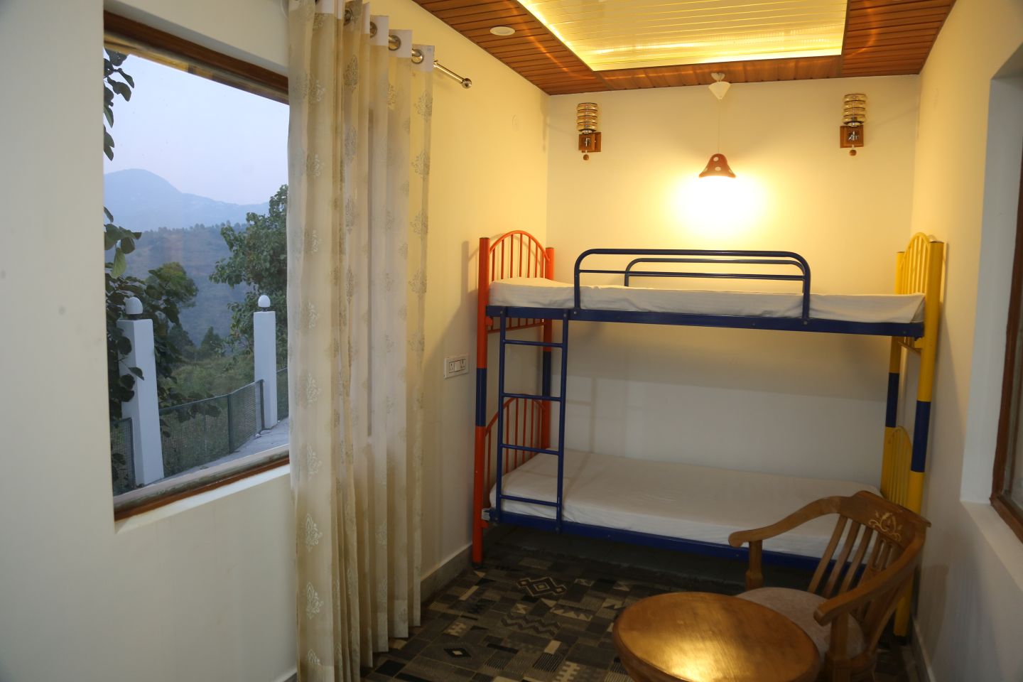 Executive Suite bunk bed with balcony mountain view