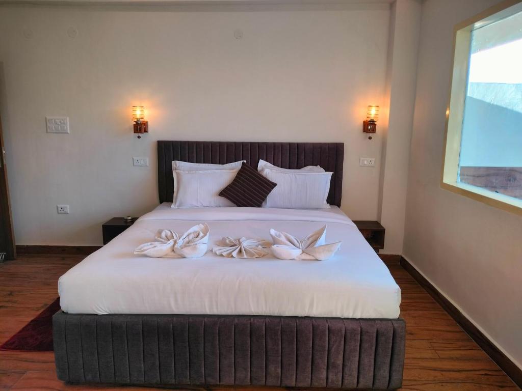 Deluxe room full size bed with warm wall lights
