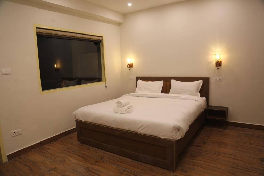 Warm ceiling lights in suite bedroom